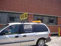 DSCF0729  C. Hall Escort with BTI OSL Sign Cross Bar Luggage Rack Mount